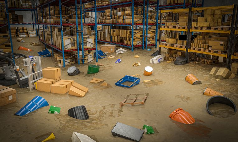 Flooded warehouse floor with floating debris