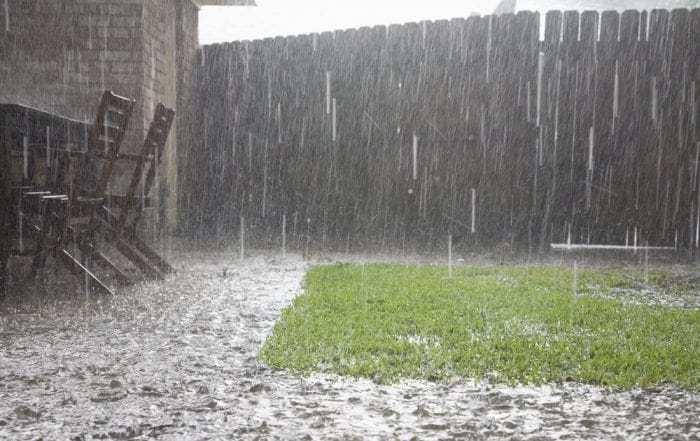 Heavy rain flooding a backyard