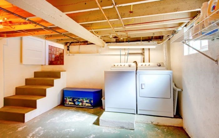 Clean basement with washer and dryer