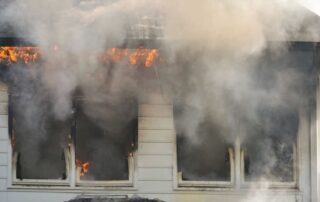 White house with fire and smoke from the windows