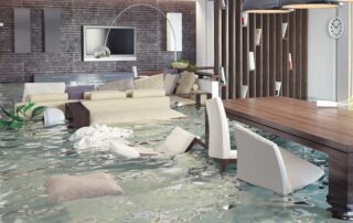 Flooded basement covering couch and chairs